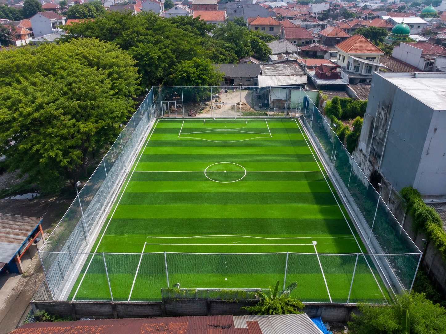 Aerial view of the netted synthetic-turf mini soccer pitch at Dupak 36.